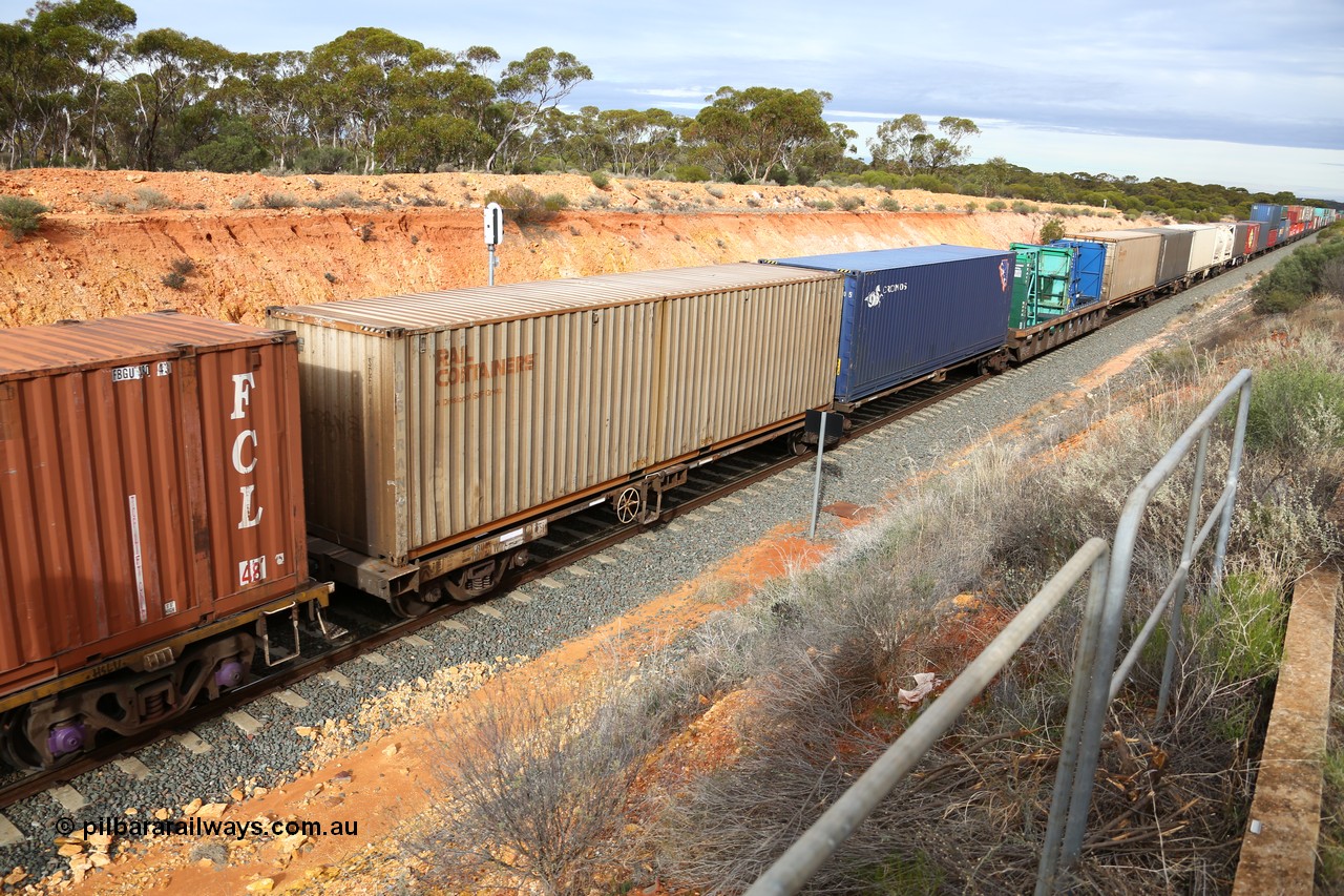 160526 5219
West Kalgoorlie, 4PM6 intermodal train, RQLY 1009 articulated 5-pack centre well waggon set, one of fourteen sets built by AN Rail Islington Workshops SA in 1991, loaded with 40' containers and two 20' high glass plate containers in well.
Keywords: RQLY-type;RQLY1009;AN-Islington-WS;AQLY-type;