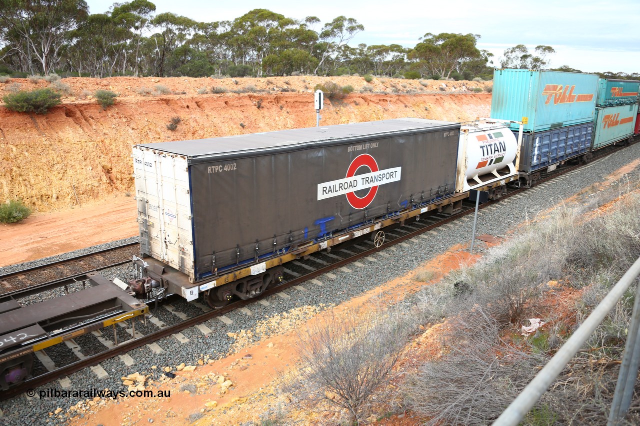 160526 5233
West Kalgoorlie, 4PM6 intermodal train, RRDY 119 container waggon with a 40' Railroad Transport curtainsider RTPC 4002 and a 20' Jamieson built Titan tanktainer. Unsure of the history of these RRDY class waggons, they appear to be SAR Islington built FQX type waggons.
Keywords: RRDY-type;RRDY119;SAR-Islington-WS;FQX-type;