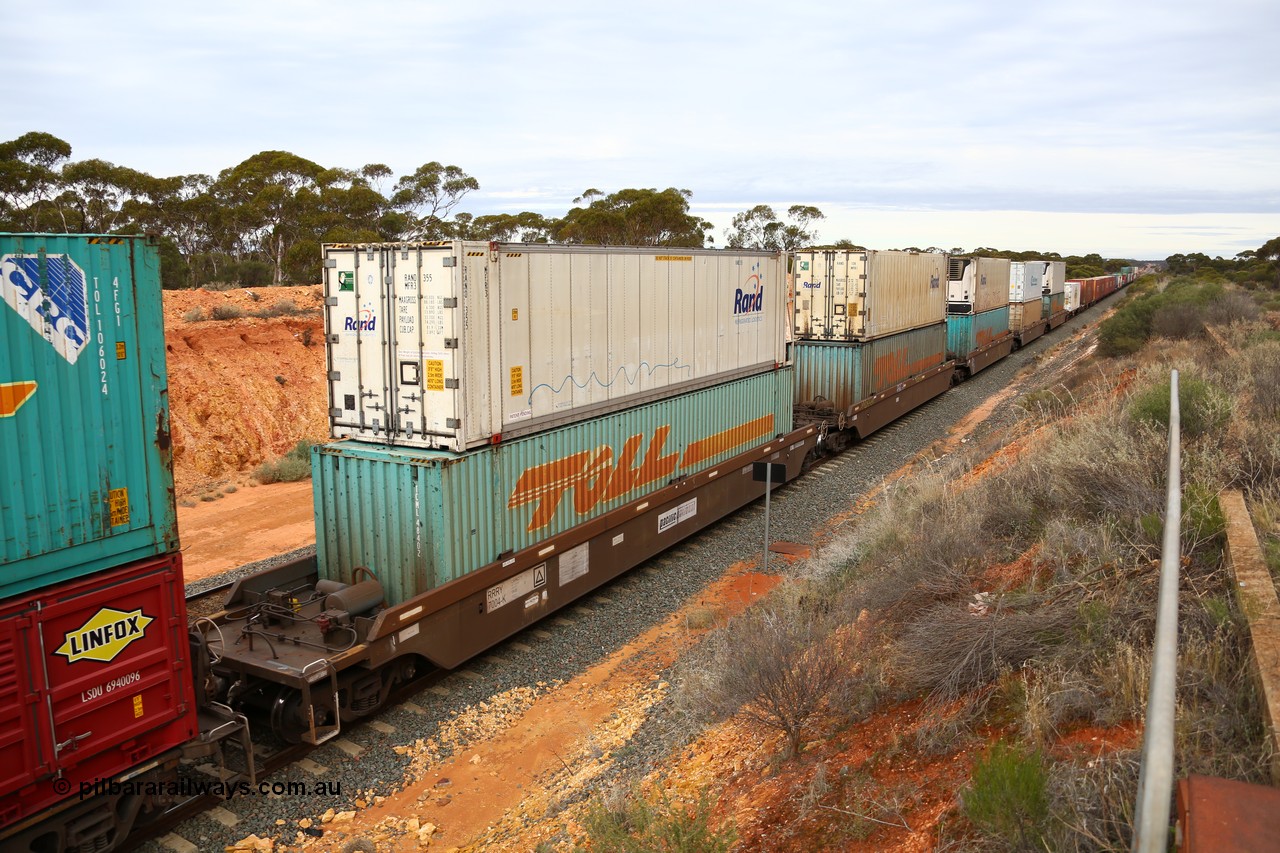 160526 5234
West Kalgoorlie, 4PM6 intermodal train, 5-pack RRRY 7004 well waggon set, one of nineteen built in China at Zhuzhou Rolling Stock Works for Goninan in 2005 double stacked with a range of 40' and 48' boxes and 46' reefers.
Keywords: RRRY-type;RRRY7004;CSR-Zhuzhou-Rolling-Stock-Works-China;