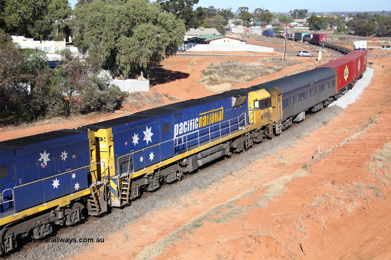 160527 5515
Kalgoorlie, 5PS6 intermodal train powers away from Kalgoorlie as it is about to pass under the Goldfields Highway, Goninan built GE model Cv40-9i NR class unit NR 96 serial 7250-06/97-297 and crew coach RZEY 3.
Keywords: NR-class;NR96;Goninan;GE;Cv40-9i;7250-06/97-297;