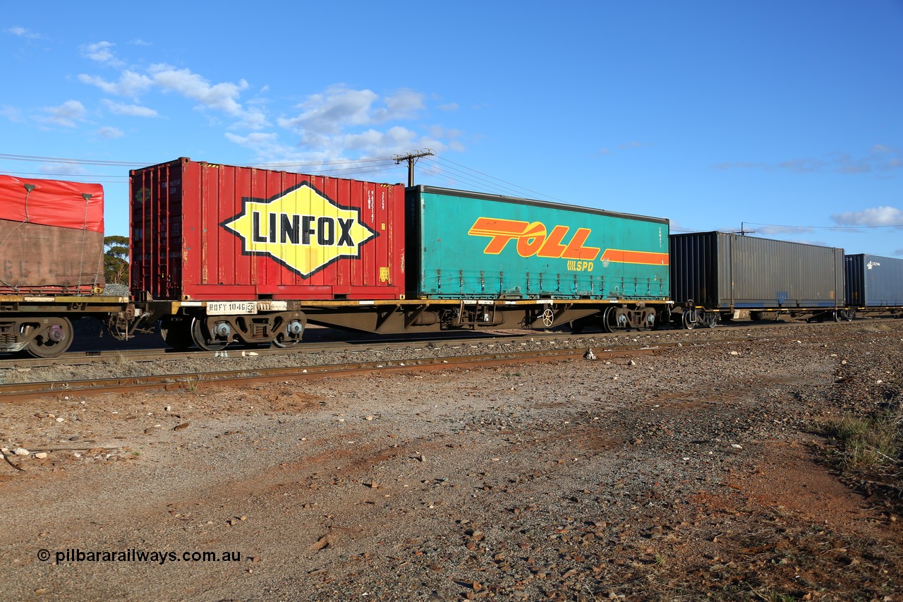 160528 8352
Parkeston, 5SP5 intermodal train, RQFY 104 container waggon, built by Victorian Railways Bendigo Workshops in 1980 as a batch of seventy five VQFX type skeletal container waggons, recoded in April 1994 RQFY and 2CM bogies fitted August 1995. Linfox 20' 2EG9 type container FSWB 963514 and Toll-SPD 40' 3NW871 curtainsider.
Keywords: RQFY-type;RQFY104;Victorian-Railways-Bendigo-WS;VQFX-type;