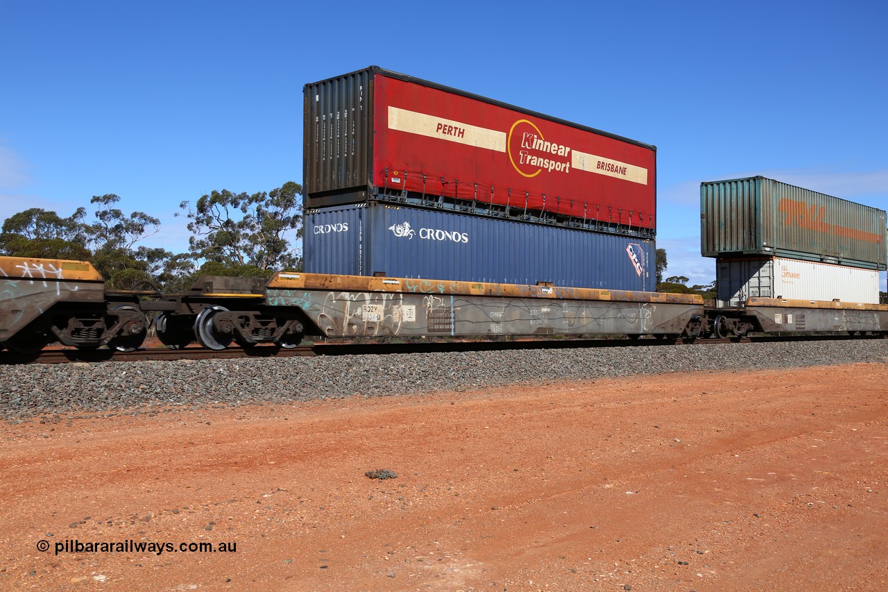 160528 8430
Binduli, intermodal train 6PM6, RQZY 7054 platform 3 of five unit bar coupled well container waggon set built in a batch of thirty two by Goninan NSW in 1995/96, loaded with a Cronos 40' 4EG1 type container TSPD 092174 double stacked with a Kinnear Transport 40' curtain sider container KIN 1.
Keywords: RQZY-type;RQZY7054;Goninan-NSW;