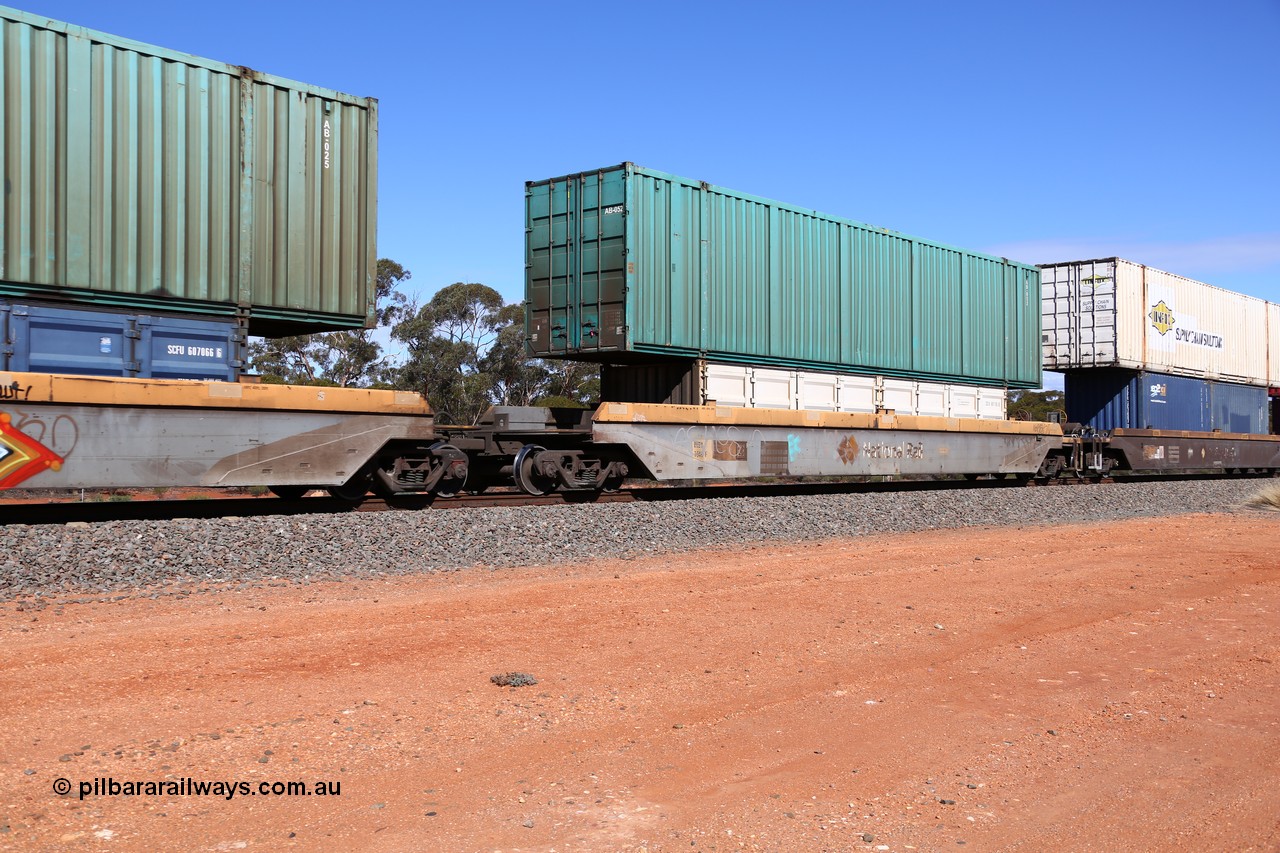 160528 8442
Binduli, intermodal train 6PM6, RQZY 7040 platform 1 of five unit bar coupled well container waggon set built in a batch of thirty two by Goninan NSW in 1995/96, loaded with a 40' half height side door container SCFU 607105 [0] double stacked with a Toll 53' car container AB 052.
Keywords: RQZY-type;RQZY7040;Goninan-NSW;