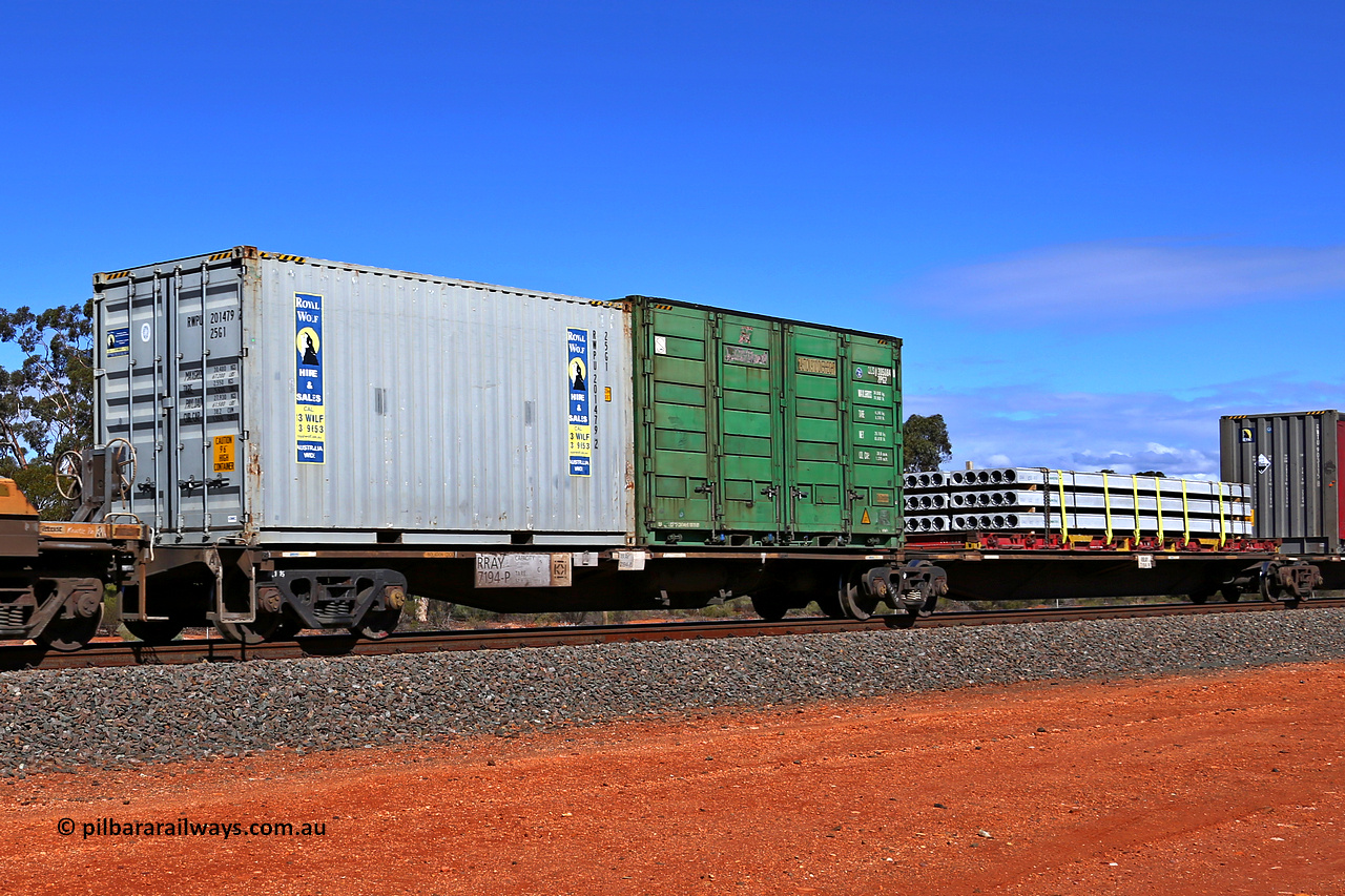 160528 8458
Binduli, intermodal train 6PM6, RRAY 7194 platforms 1 and 2 of 5-pack articulated skeletal waggon set, one of a hundred built by ABB Engineering NSW between 1996-2000, loaded with a 20' Royal Wolf 25G1 type container RWPU 201479 [2] and 20' 2PG2 type side door container QLSU 305084 [8] on platform 1 and a 40' K&S flat rack KT 118 with concrete panels on platform 2.
Keywords: RRAY-type;RRAY7194;ABB-Engineering-NSW;