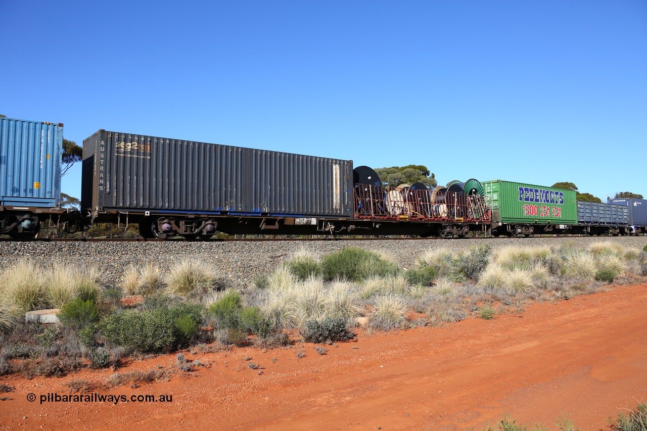 160530 9252
Binduli, 7SP3 intermodal service, container waggon RQJW 22067, one of fifty built by Mittagong Engineering NSW in 1975-76 as JCW type, recoded to NQJW. Loaded with an 40' FD type flatrack with cable drums and a 40' SCF - Austrans sea2rail container AUSU 408190.
Keywords: RQJW-type;RQJW22067;Mittagong-Engineering-NSW;JCW-type;NQJW-type;