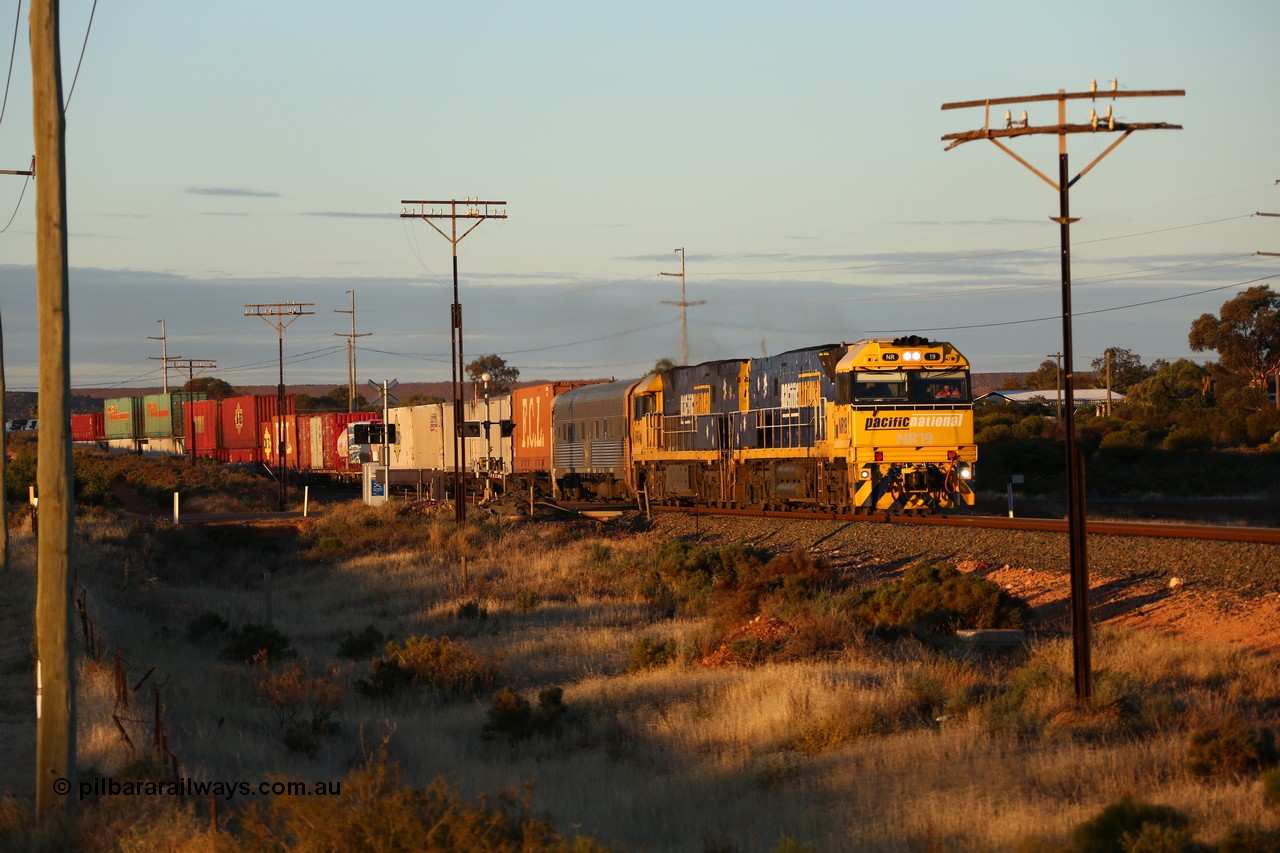 160601 10084
West Kalgoorlie, 2MP5 intermodal service climbs up the grade from Kalgoorlie across Gateacre Road at the 651 km post behind Goninan built GE model Cv40-9i NR class unit NR 19 serial 7250-03/97-221 and a sister unit and 24 waggons for 1464 metres and 3936 tonnes.
Keywords: NR-class;NR19;Goninan;GE;Cv40-9i;7250-03/97-221;