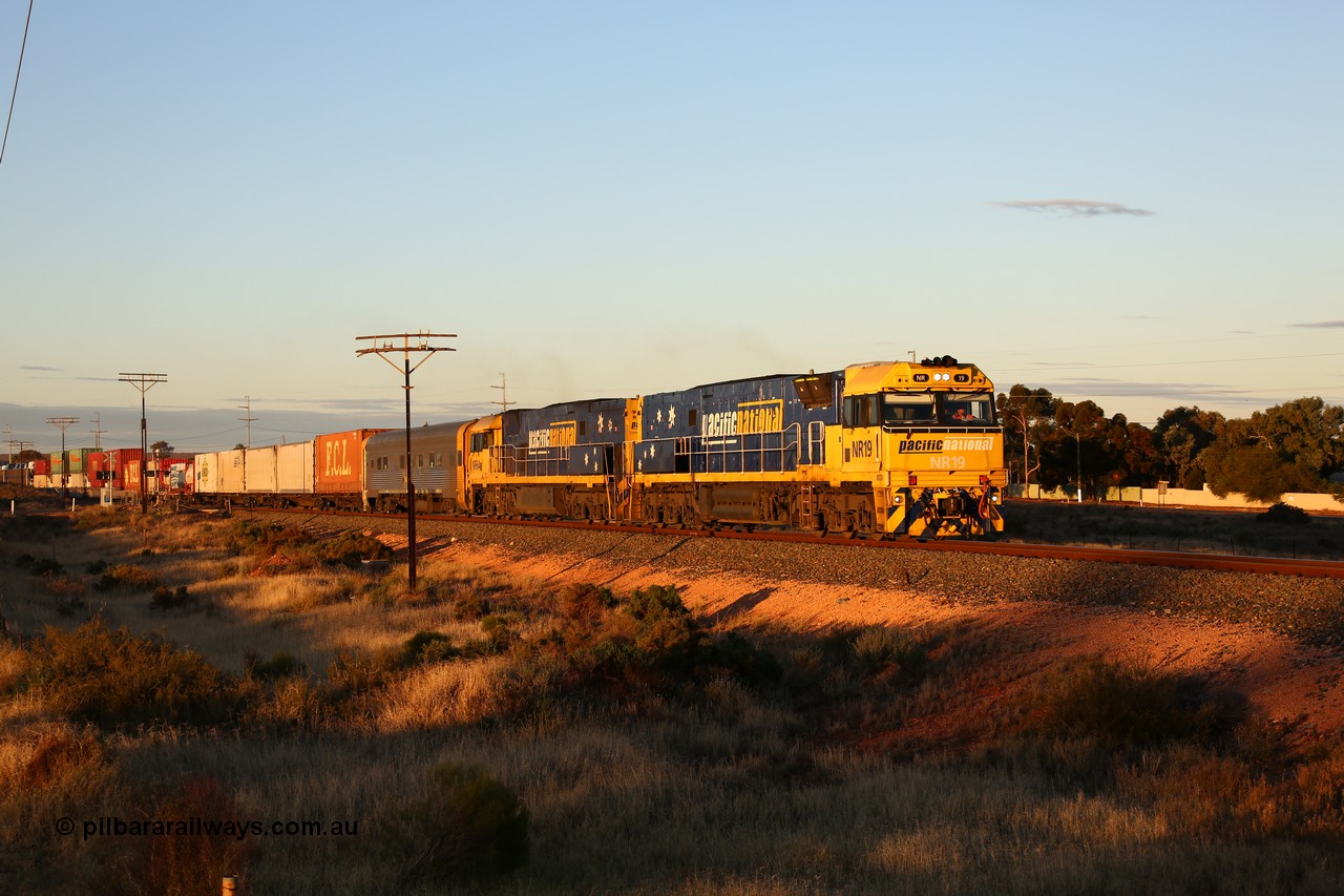 160601 10086
West Kalgoorlie, 2MP5 intermodal service climbs up the grade from Kalgoorlie across Gateacre Road at the 651 km post behind Goninan built GE model Cv40-9i NR class unit NR 19 serial 7250-03/97-221 and a sister unit and 24 waggons for 1464 metres and 3936 tonnes.
Keywords: NR-class;NR19;Goninan;GE;Cv40-9i;7250-03/97-221;
