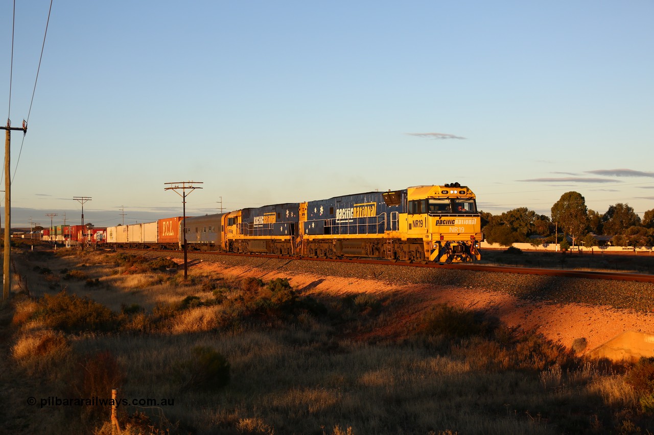 160601 10087
West Kalgoorlie, 2MP5 intermodal service climbs up the grade from Kalgoorlie across Gateacre Road at the 651 km post behind Goninan built GE model Cv40-9i NR class unit NR 19 serial 7250-03/97-221 and a sister unit and 24 waggons for 1464 metres and 3936 tonnes.
Keywords: NR-class;NR19;Goninan;GE;Cv40-9i;7250-03/97-221;