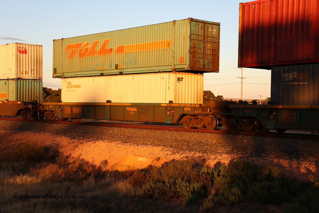 160601 10120
West Kalgoorlie, 2MP5 intermodal train, RRXY 9 platform 5 of 5-pack well waggon set, one of eleven built by Bradken Qld in 2002 for Toll from a Williams-Worley design with a 40' Rail Containers box SCFU 412261 in the well with a 48' Toll box TCML 48448 on top.
Keywords: RRXY-type;RRXY9;Williams-Worley;Bradken-Rail-Qld;