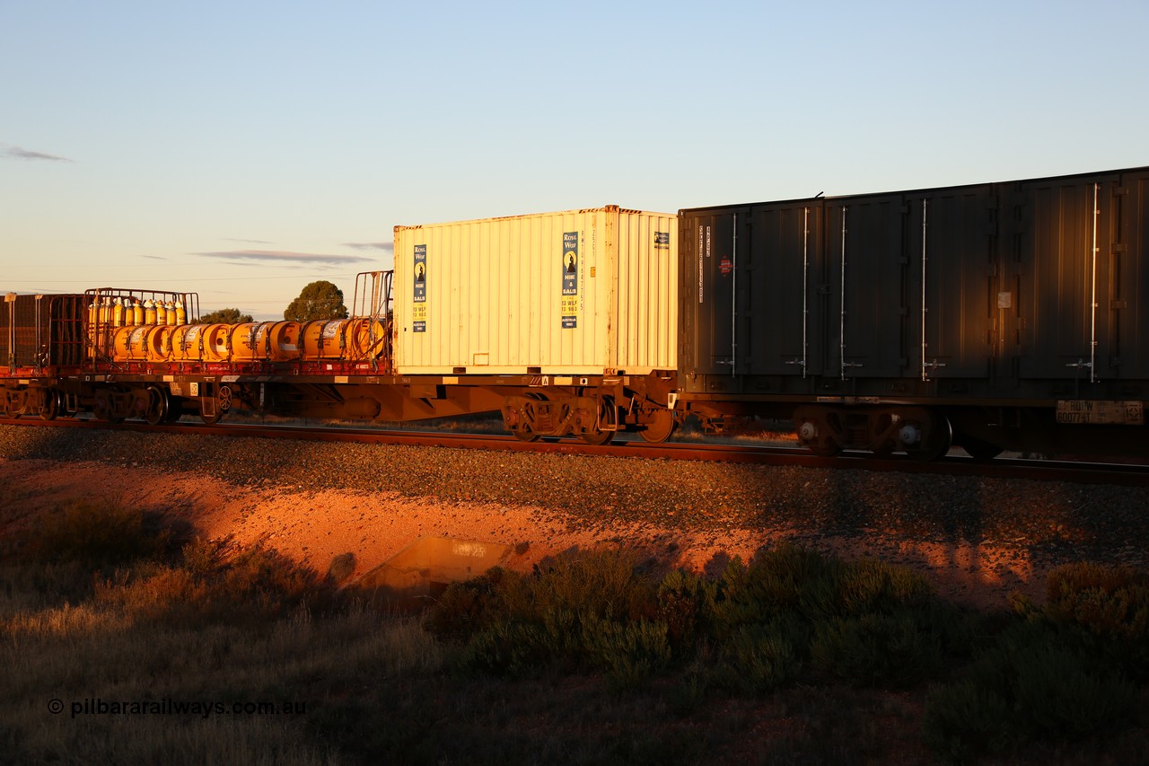 160601 10138
West Kalgoorlie, 2MP5 intermodal train, NQKY 34693 container waggon, originally built by EPT NSW as an open waggon type CDY in a batch of two hundred in 1975/76, recoded to NOCY. 20' Royal Wolf box RWTU 964775 and a KT type 40' flatrack KT 400273 loaded with IOXM chlorine gas cylinders.
Keywords: NQKY-type;NQKY34693;EPT-NSW;CDY-type;NOCY-type;