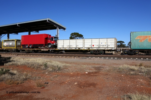 160522 2126
Parkeston, 6MP4 intermodal train, RQJW type container waggon RQJW 21964 built by Mittagong Engineering NSW as part of a batch of twenty five NQJW type waggons in 1981, loaded with half height side door SCF container SCFU 607093 and a flatrack with a Regal Transport truck.
Keywords: RQJW-type;RQJW21964;Mittagong-Engineering-NSW;NQJW-type;