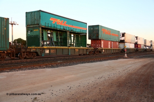160523 2722
Parkeston, 1PM5 intermodal train, RRXY 4 a 5-pack well waggon set, one of eleven built by Bradken Qld in 2002 for Toll from a Williams-Worley design with a motley load of double stacked boxes off all decrees.
Keywords: RRXY-type;RRXY4;Williams-Worley;Bradken-Rail-Qld;