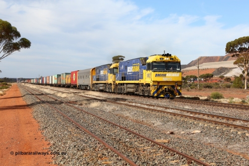 160523 2929
Parkeston, 7SP3 intermodal train, a pair of Goninan built GE model Cv40-9i NR class units NR 12 serial 7250-02/97-214 and NR 51 serial 7250-08/97-253 lead the train 'elephant style' out of the dip and along the mainline at the 1776 km. The PN local is in the car at the gantry performing a roll-by, the track on the left is the Engineers Siding.
Keywords: NR-class;NR12;Goninan;GE;Cv40-9i;7250-02/97-214;