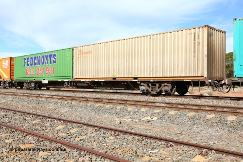 160523 2991
Parkeston, 7SP3 intermodal train, RQPW 60078 jumbo container waggon, 80' waggon built by Victorian Railways' Bendigo Workshops as a VQDW October 1984. Leased to NSW State Rail as NQMW type in 1986, recoded to RQDF in 1994, RQDW later in 1994 before RQPW in 1995. Loaded with a Austrans leased Rail Containers 40' 4EG1 type box AUSU 410187[6] and Pedemonts 40' 4EG1 type box PHR 412.
Keywords: RQPW-type;RQPW60078;Victorian-Railways-Bendigo-WS;VQDW-type;VQDW74;NQWM-type;NQWM60078;RQDF-type;