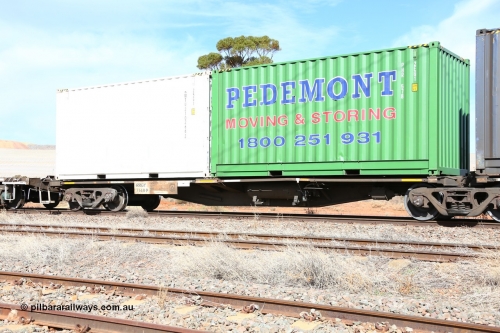 160523 3001
Parkeston, 7SP3 intermodal train, RRGY 7149 platform 1, the RRGY type is a 5-pack articulated skeletal container waggon, fifty were originally built by AN Rail Islington Workshops in 1996-97 as type RRBY, later rebuilt with 48' intermediate decks and recoded to RRGY. Loaded with a Pedemonts 20' 2EG1 type box PHR 578 and a Royal Wolf 20' 25G1 type box RWTU 210266[2].
Keywords: RRGY-type;RRGY7149;AN-Islington-WS;RRBY-type;