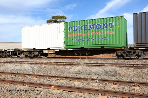 160523 3002
Parkeston, 7SP3 intermodal train, RRGY 7149 platform 1, the RRGY type is a 5-pack articulated skeletal container waggon, fifty were originally built by AN Rail Islington Workshops in 1996-97 as type RRBY, later rebuilt with 48' intermediate decks and recoded to RRGY. Loaded with a Pedemonts 20' 2EG1 type box PHR 578 and a Royal Wolf 20' 25G1 type box RWTU 210266[2].
Keywords: RRGY-type;RRGY7149;AN-Islington-WS;RRBY-type;