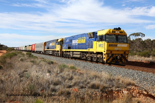 160523 3209
Binduli, Perth bound 7SP3 intermodal train, a pair of Goninan built GE model Cv40-9i NR class units NR 12 serial 7250-02/97-214 and NR 51 serial 7250-08/97-253 lead the train 'elephant style' near the 641 km.
Keywords: NR-class;NR12;Goninan;GE;Cv40-9i;7250-02/97-214;
