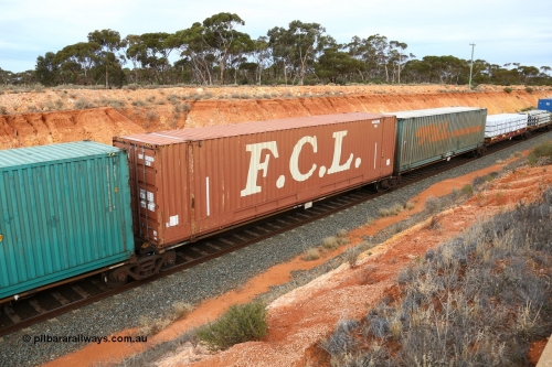 160524 3783
West Kalgoorlie, 2PM6 intermodal train, RRGY 7144 platform 2 of 5-pack articulated skeletal waggon set, one of fifty originally built by AN Rail Islington Workshops in 1996-97 as type RRBY, later rebuilt with 48' intermediate decks and recoded to RRGY, FCL 48' box FXGU 328034[2].
Keywords: RRGY-type;RRGY7144;AN-Islington-WS;RRBY-type;