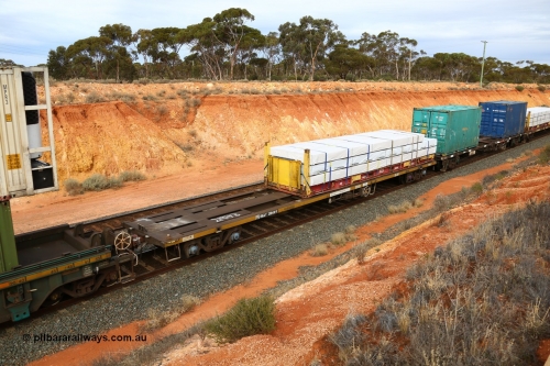 160524 3805
West Kalgoorlie, 2PM6 intermodal train, RQAY 21943 container waggon, one of a hundred waggons built in 1981 by EPT NSW as type NQAY, recoded to RQAY in 1994 with a 40' K&S flatrack KHS 400633 with Wesbeam products.
Keywords: RQAY-type;RQAY21943;EPT-NSW;NQAY-type;