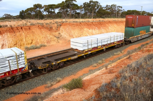 160524 3818
West Kalgoorlie, 2PM6 intermodal train, RQSY 34979 container flat waggon originally built by Goninan NSW in a batch of one hundred OCY type in 1975, recoded to NQOY, the modified to NQSY. Loaded with a K&S 40' flatrack KHS 400635 with Wesbeam timber products.
Keywords: RQSY-type;RQSY34979;Goninan-NSW;OCY-type;NQOY-type;NQSY-type;