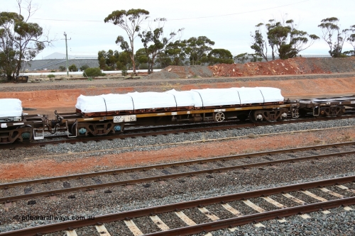 160524 4315
West Kalgoorlie, 1MP2 steel train, container waggon RKLY 20925 with a couple of plastic wrapped flatrack units. Originally built in the third contract of two hundred NODY type open waggons built by EPT NSW in 1980/81. Several recodes later it is fitted for containers, primarily steel traffic.
Keywords: RKLY-type;RKLY20925;EPT-NSW;NODY-type;