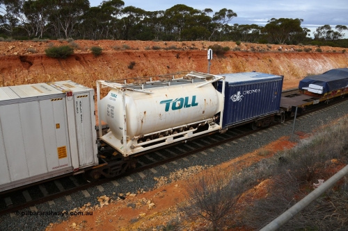 160526 5212
West Kalgoorlie, 4PM6 intermodal train, RRAY 7167 platform 5 of 5-pack articulated skel waggon set, one of a hundred built by ABB Engineering NSW in 1996-2000, 40' deck with a 20' Toll tanktainer JTSU 011429 and a Cronos tarp top 20 box CXSU 122034.
Keywords: RRAY-type;RRAY7167;ABB-Engineering-NSW;