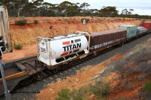 160526 5248
West Kalgoorlie, 4PM6 intermodal train, RQSY 34967 container waggon, one of one hundred built by Goninan NSW as OCY class in 1975, recoded to NQOY then NQSY. Jamieson 20' tanktainer K8122 for Titan and a 40' KT class flatrack with a tarped load.
Keywords: RQSY-type;RQSY34967;Goninan-NSW;OCY-type;NQOY-type;NQSY-type;