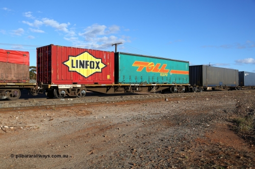 160528 8352
Parkeston, 5SP5 intermodal train, RQFY 104 container waggon, built by Victorian Railways Bendigo Workshops in 1980 as a batch of seventy five VQFX type skeletal container waggons, recoded in April 1994 RQFY and 2CM bogies fitted August 1995. With a Toll 40' curtainsider 3NW 871 and a Linfox 20' 2EG9 type box FSWB 9635147.
Keywords: RQFY-type;RQFY104;Victorian-Railways-Bendigo-WS;VQFX-type;