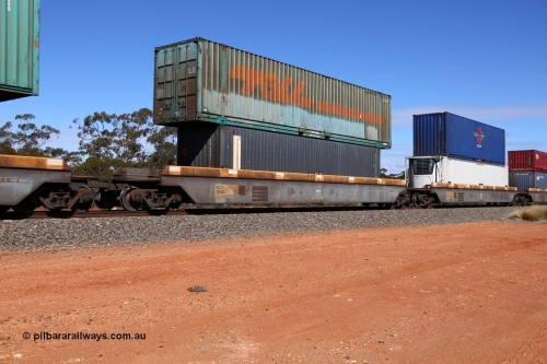 160528 8435
Binduli, intermodal train 6PM6, RQZY 7064 platform 3 of five unit bar coupled well container waggon set built in a batch of thirty two by Goninan NSW in 1995/96, loaded with an SCFU 40' (4EG1 type by the looks) container SCFU 408004[8] double stacked with a Toll (ex Macfield) 48' container TERF 48086.
Keywords: RQZY-type;RQZY7064;Goninan-NSW;