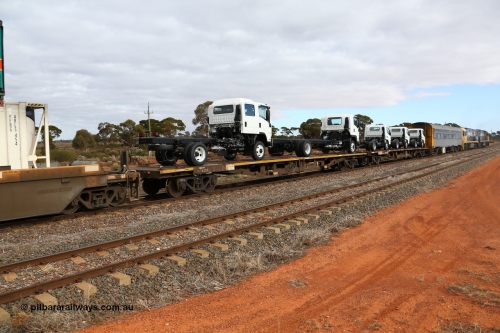 160529 8765
Parkeston, 6MP4 intermodal train, RRKY 4335 container waggon, originally built in a batch of one hundred and fifty by Perry Engineering SA in 1975 as RMX type, recoded to AQMX, and RQKY, loaded with two Isuzu cab-chassis trucks.
Keywords: RRKY-type;RRKY4335;Perry-Engineering-SA;RMX-type;AQMX-type;RQKY-type;