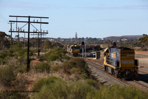 160531 9887
West Kalgoorlie, Pacific National's Goninan built GE model Cv40-9i NR class unit NR 94 serial 7250-06/97-300 waits as it shunts 3PM4 steel train as opposing steel train 1MP2 arrives behind sister NR class NR 100. 31st of May 2016.
Keywords: NR-class;NR94;Goninan;GE;Cv40-9i;7250-06/97-300;