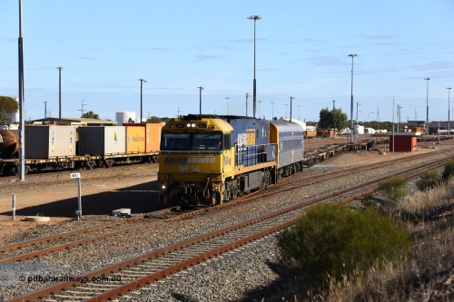 160531 9936
West Kalgoorlie, 3PM4 steel train, Goninan built GE model Cv40-9i NR class unit NR 94 serial 7250-06/97-300 shunts empty container waggons from the yard past the 651 km post, to put on the front of its train for the journey back east.
Keywords: NR-class;NR34;Goninan;GE;Cv40-9i;7250-06/97-300;