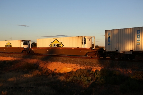 160601 10101
West Kalgoorlie, 2MP5 intermodal train, platform 5 of 5-pack RRRY 7011 well waggon set, one of nineteen built in China at Zhuzhou Rolling Stock Works for Goninan in 2005, Linfox 46' 6