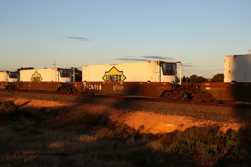 160601 10103
West Kalgoorlie, 2MP5 intermodal train, platform 3 of 5-pack RRRY 7011 well waggon set, one of nineteen built in China at Zhuzhou Rolling Stock Works for Goninan in 2005, Linfox 46' 6