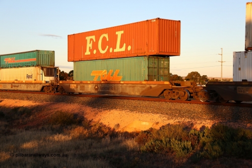 160601 10110
West Kalgoorlie, 2MP5 intermodal train, RRZY 7019 platform 1 of 5-pack well waggon set of twenty six waggon sets built by Goninan in 1995-96 for National Rail as RQZY, later rebuilt and recoded as RRZY, double stacked with an FCL 48' box FBGU 480221[6] and Toll 40' 4FG1 type box TRRC 410629[1].
Keywords: RRZY-type;RRZY7019;Goninan-NSW;RQZY-type;