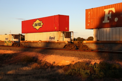 160601 10114
West Kalgoorlie, 2MP5 intermodal train, RQZY 7065 platform 2 of 5-pack well waggon set one of thirty two waggon sets built by Goninan NSW for National Rail in 1995-96, double stacked with a Linfox 48' MFG1 type box DRC 477 and Rand Refrigerated Logistics 46' 6