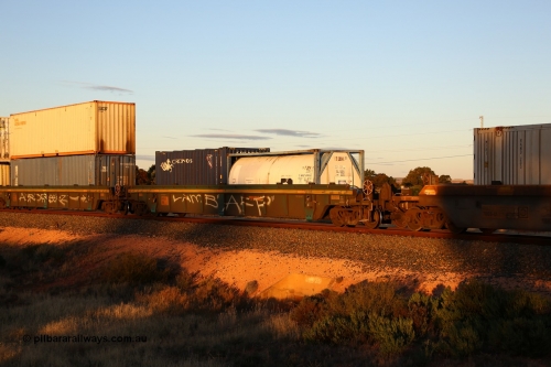 160601 10116
West Kalgoorlie, 2MP5 intermodal train, RRXY 9 platform 1 of 5-pack well waggon set, one of eleven built by Bradken Qld in 2002 for Toll from a Williams-Worley design with a 20' Transamerica Leasing 22T6 type ISO tank T 2614 and a 20' Cronos 2EB0 type box TSPD 122162.
Keywords: RRXY-type;RRXY9;Williams-Worley;Bradken-Rail-Qld;