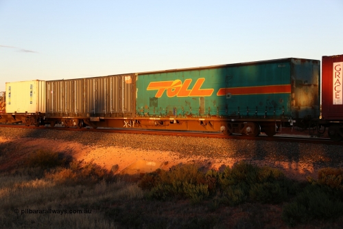 160601 10137
West Kalgoorlie, 2MP5 intermodal train, RQPW 60077 jumbo container waggon built by V/Line Bendigo Workshops in a batch of twenty five in 1984-86 as a VQDW type, leased to NSWGR in 1987 and coded NQMW numbered 60077, loaded with two 40' units, Toll 40' curtainsider 4TL 135 and 40' 4PG2 type SCF side door container SCFU 611130[1].
Keywords: RQPW-type;RQPW60077;Vline-Bendigo-WS;VQDW-type;VQDW69;
