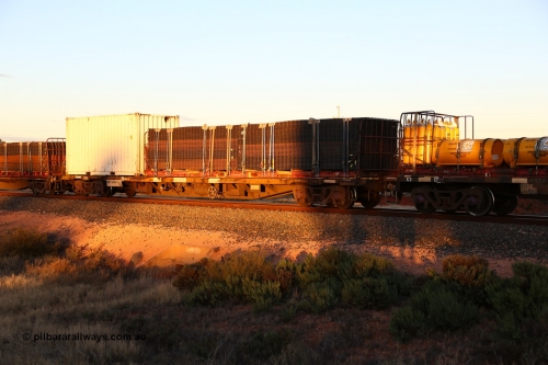 160601 10140
West Kalgoorlie, 2MP5 intermodal train, NQOY 14959 container waggon, one of fifty built by Tulloch Ltd NSW as type OCY in 1974/75 with a 40' K&S flatrack KT 4 loaded with mesh and a 20' 25G1 type box RWTU 962017[9].
Keywords: NQOY-type;NQOY14959;Tulloch-Ltd-NSW;OCY-type;