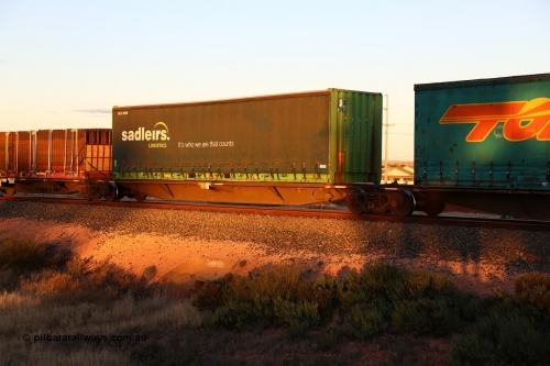 160601 10143
West Kalgoorlie, 2MP5 intermodal train, RRAY 7163 platform 4 of 5-pack articulated skel waggon set, 1 of 100 built by ABB Engineering NSW 1996-2000, 48' deck with a 40' Sadleirs curtainsider RCS 4038.
Keywords: RRAY-type;RRAY7163;ABB-Engineering-NSW;