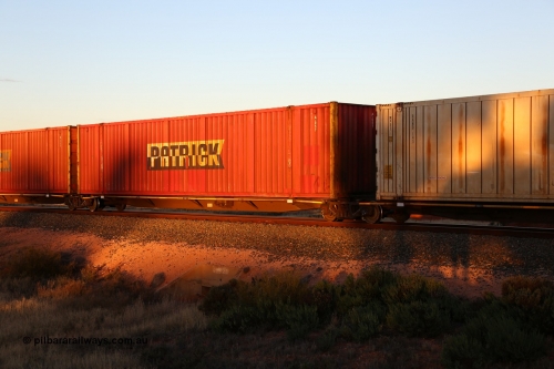 160601 10152
West Kalgoorlie, 2MP5 intermodal train, RRYY 22 platform 3 of 5-pack articulated low profile skel waggon set, one of fifty two such sets built by Bradken Rail Braemar from a Williams-Worley design, based on the TNT TRAY type for moving automotive carrying containers, Patrick 53' automotive container A 057.
Keywords: RRYY-type;RRYY22;Williams-Worley;Bradken-NSW;