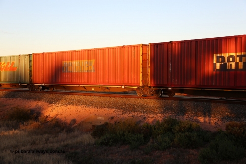 160601 10153
West Kalgoorlie, 2MP5 intermodal train, RRYY 22 platform 2 of 5-pack articulated low profile skel waggon set, one of fifty two such sets built by Bradken Rail Braemar from a Williams-Worley design, based on the TNT TRAY type for moving automotive carrying containers, Patrick 53' automotive container A 117.
Keywords: RRYY-type;RRYY22;Williams-Worley;Bradken-NSW;