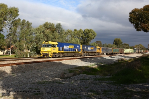 160609 0389
Woodbridge, 5PM5 intermodal train arrives at the triangle and splits signal post 82 and 84 with power from Goninan built GE model Cv40-9i NR class unit NR 35 serial 7250-06/97-237 and a sister unit with 39 waggons for a length of 1791 metres and 3960 tonnes. Behind the crew coach are the Sadleirs louvre vans and an RMEY triple deck articulated car carrying waggon.
Keywords: NR-class;NR35;Goninan;GE;Cv40-9i;7250-06/97-237;