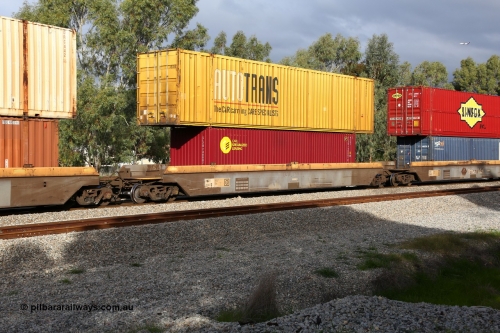 160609 0473
Woodbridge, 5PM5 intermodal train, RRZY 7049 platform 2 of 5-pack well waggon set, one of thirty two sets built by Goninan NSW in 1995-96 for National Rail as RQZY type, recoded to RRZY when repaired with a CARU Specialized Leasing 40' 4EG1 type box SLZU 740007[7] and a 53' AutoTrans box AB 040.
Keywords: RRZY-type;RRZY7049;Goninan-NSW;RQZY-type;
