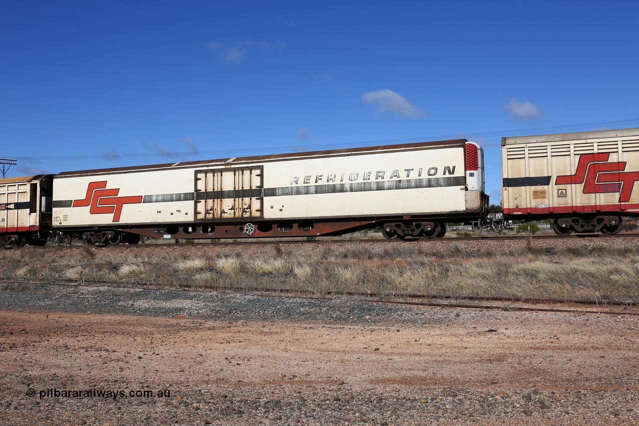 160522 2273
Parkeston, SCT train 6MP9 operating from Melbourne to Perth, ARFY type ARFY 2181 refrigerated van with New Zealand built Fairfax body mounted on an original Commonwealth Railways ROX container waggon built by Comeng Quds in 1970, recoded to AFQX, then AQOX and RQOY before being fitted with the refrigerated body for SCT service circa 1998. 
Keywords: ARFY-type;ARFY2181;Fairfax-NZL;Comeng-Qld;ROX-type;AQOX-type;