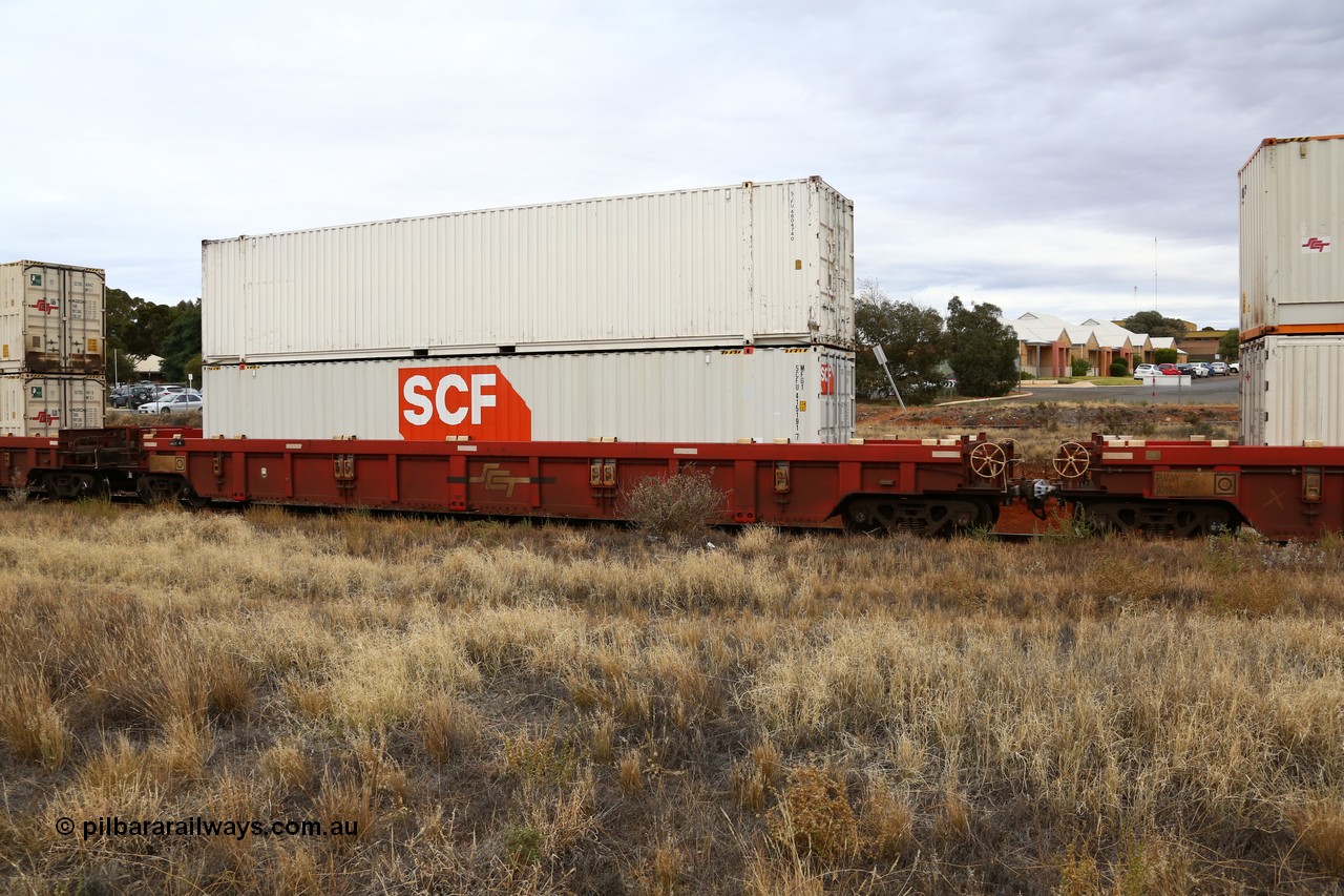 160524 3664
Kalgoorlie, SCT train 2PM9 operating from Perth to Melbourne, PWWY type PWWY 0032 one of forty well waggons built by Bradken NSW for SCT, loaded with a pair of SCF 48' MFG1 type boxes, SCFU 415191 with fresh logo, and SCFU 480474 looking well worn.
Keywords: PWWY-type;PWWY0032;Bradken-NSW;