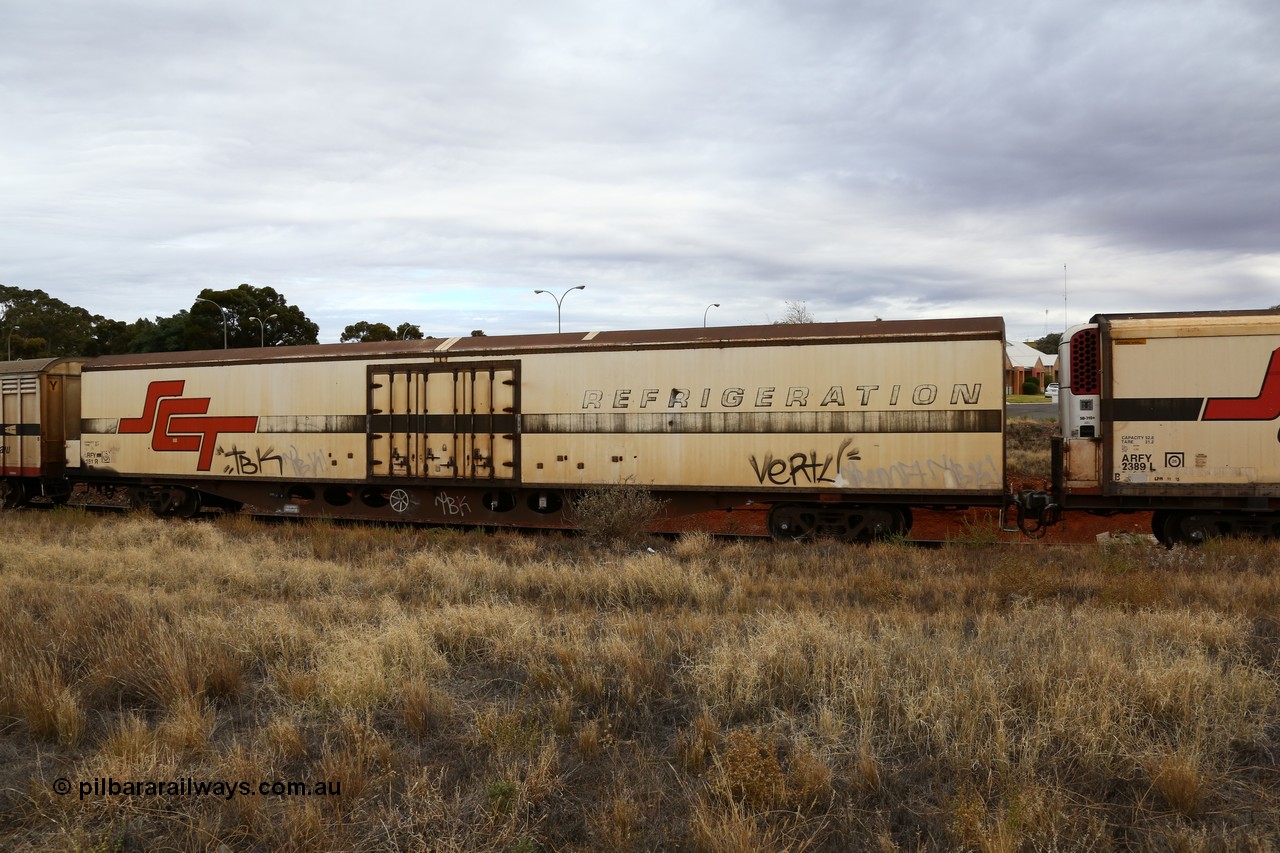 160524 3702
Kalgoorlie, SCT train 2PM9 operating from Perth to Melbourne, ARFY type ARFY 2181 refrigerated van with New Zealand built Fairfax body mounted on an original Commonwealth Railways ROX container waggon built by Comeng Quds in 1970, recoded to AFQX, then AQOX and RQOY before being fitted with the refrigerated body for SCT service circa 1998. 
Keywords: ARFY-type;ARFY2181;Fairfax-NZL;Comeng-Qld;ROX-type;AQOX-type;