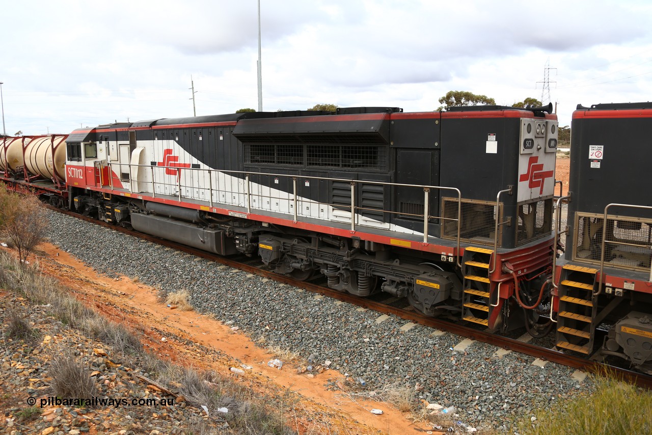 160526 5279
West Kalgoorlie, SCT train 3MP9 operating from Melbourne to Perth, with 76 waggons for 5709.8 tonnes and 1795 metres with EDI Downer built EMD model GT46C-ACe unit SCT 012 serial 08-1736 as second unit to sister unit SCT 014 as they hold the mainline in West Kalgoorlie waiting for the Prospector railcar to cross.
Keywords: SCT-class;SCT012;EDI-Downer;EMD;GT46C-ACe;08-1736;