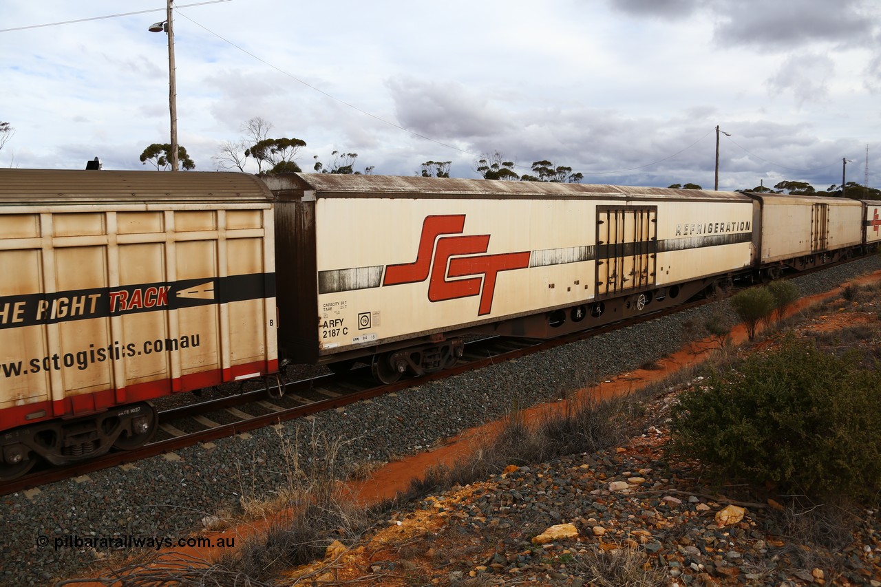 160526 5356
West Kalgoorlie, SCT train 3MP9 operating from Melbourne to Perth, ARFY type ARFY 2187 refrigerated van with the original style short side doors Fairfax (NZL) built fibreglass body that has been fitted to a Comeng Qld 1970 built RO type flat waggon that was in service with Commonwealth Railways and recoded though ROX - AQOX - AQOY - RQOY codes before conversion.
Keywords: ARFY-type;ARFY2187;Fairfax-NZL;Comeng-Qld;RO-type;AQOX-type;