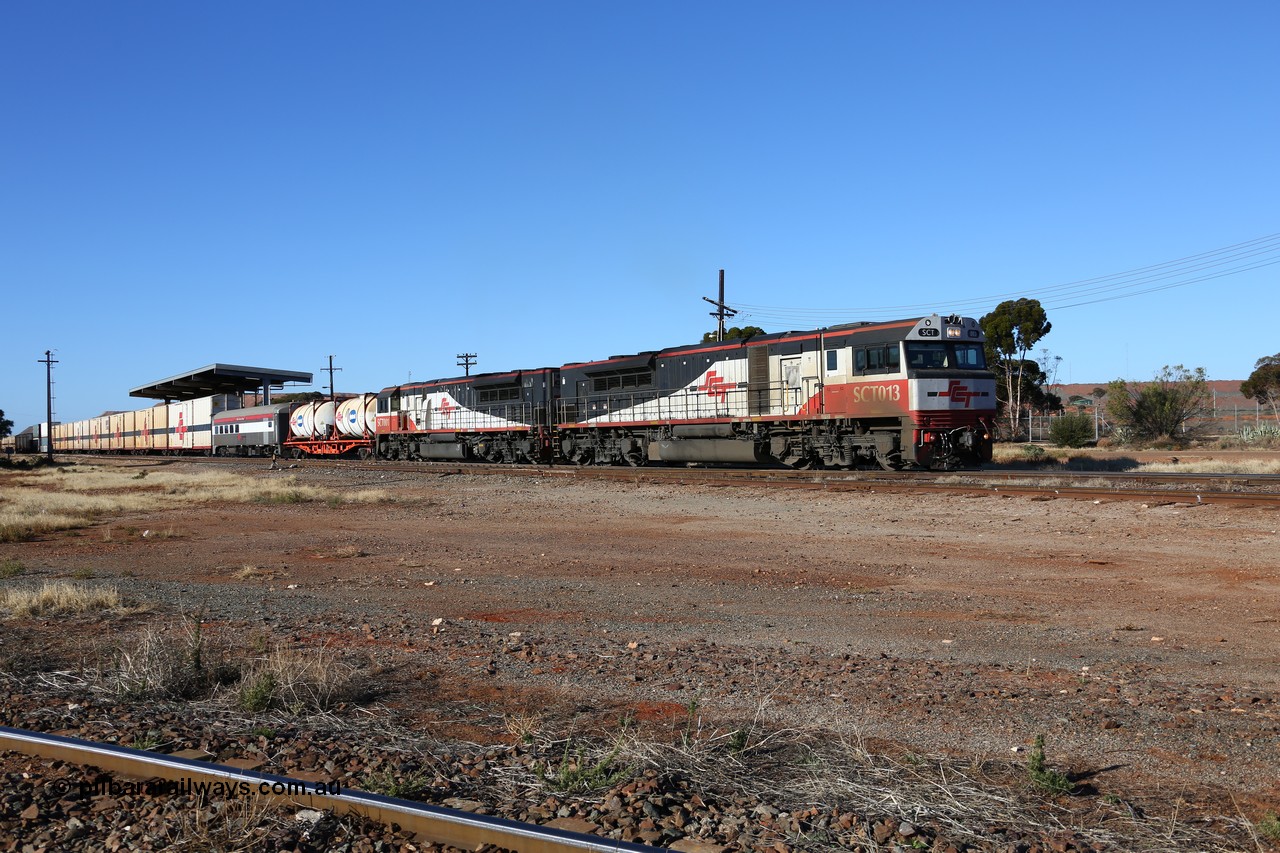 160530 9165
Parkeston, SCT train 7GP1 which operates from Parkes NSW (Goobang Junction) to Perth departs on the mainline behind SCT class SCT 013 serial 08-1737 an EDI Downer built EMD model GT46C-ACe and sister loco SCT 001 with 71 waggons for 5275 tonnes and 1679 metres.
Keywords: SCT-class;SCT013;EDI-Downer;EMD;GT46C-ACe;08-1737;